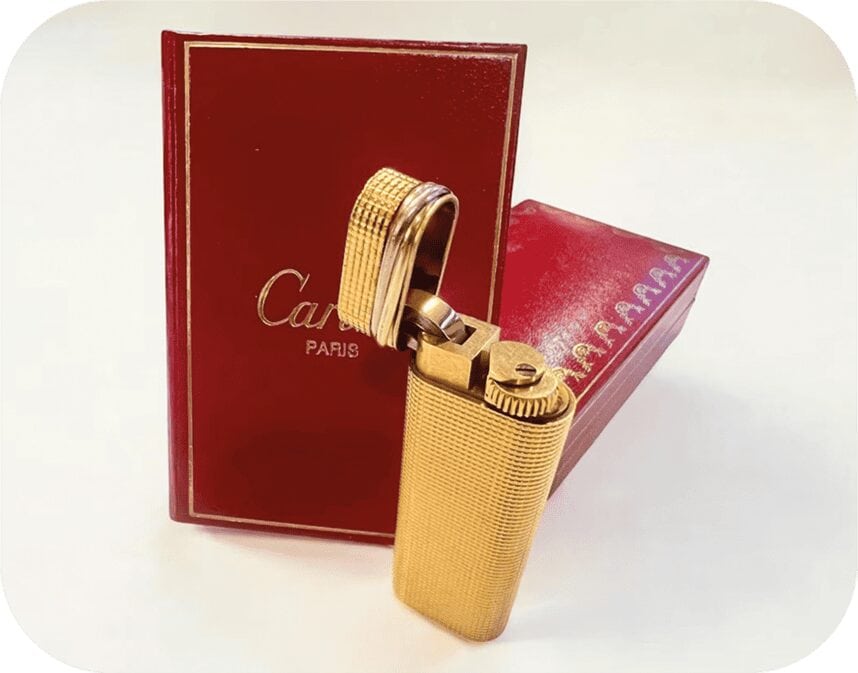 Gold Cartier lighter with original red box