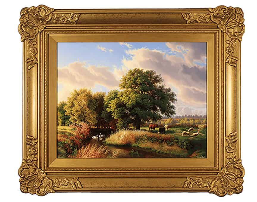 Oil painting of a pastoral landscape in a gilt frame