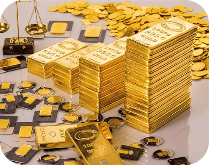 Stacked one kilo gold bars, minted bars and gold coins