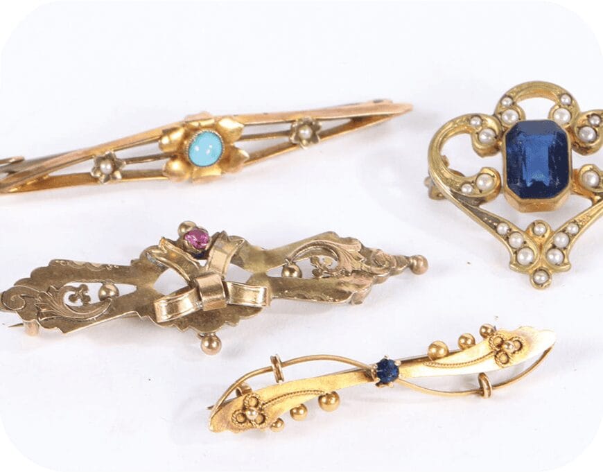 Antique gold bar brooches set with sapphire, ruby and seed pearls