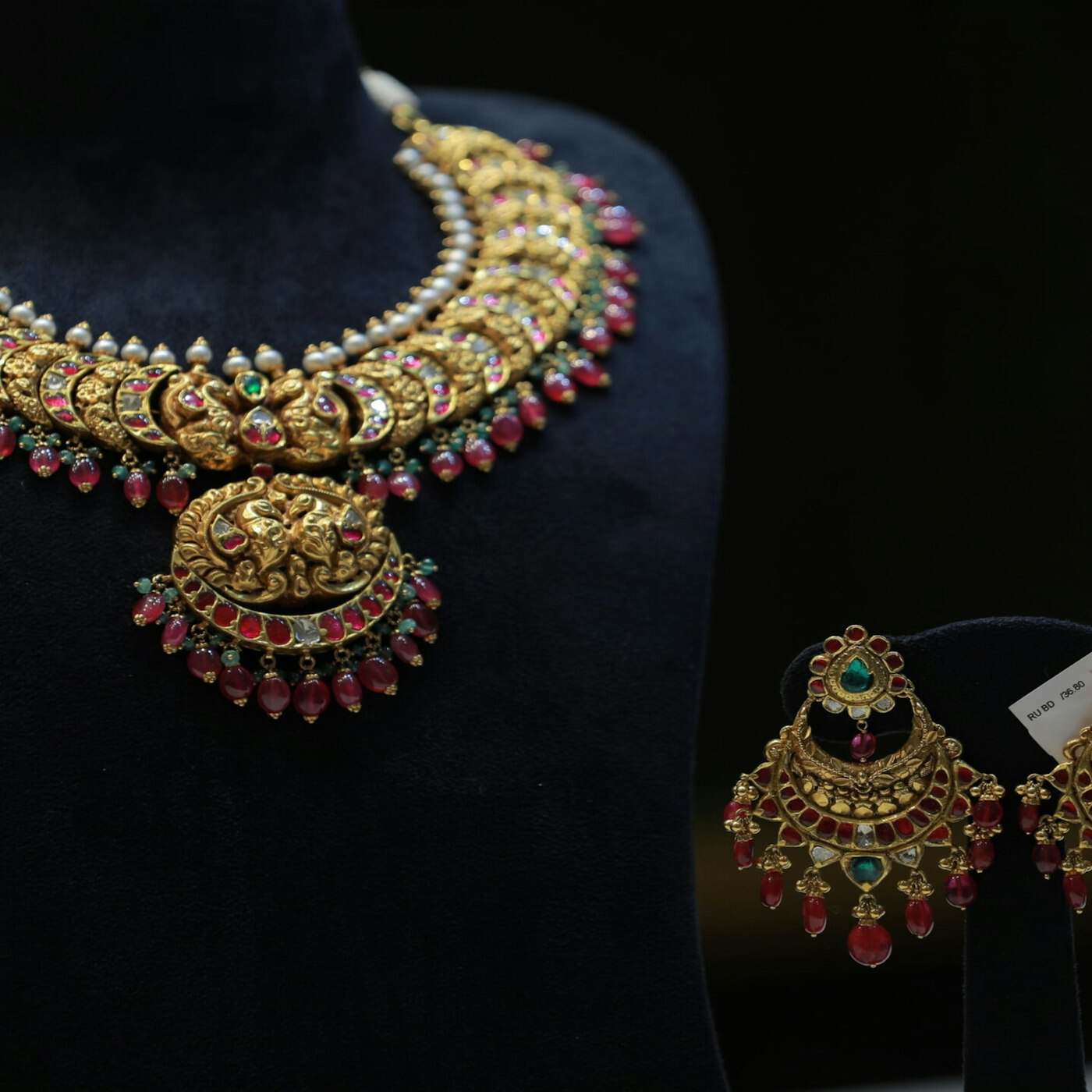 A tangle of brightly coloured beaded costume necklaces