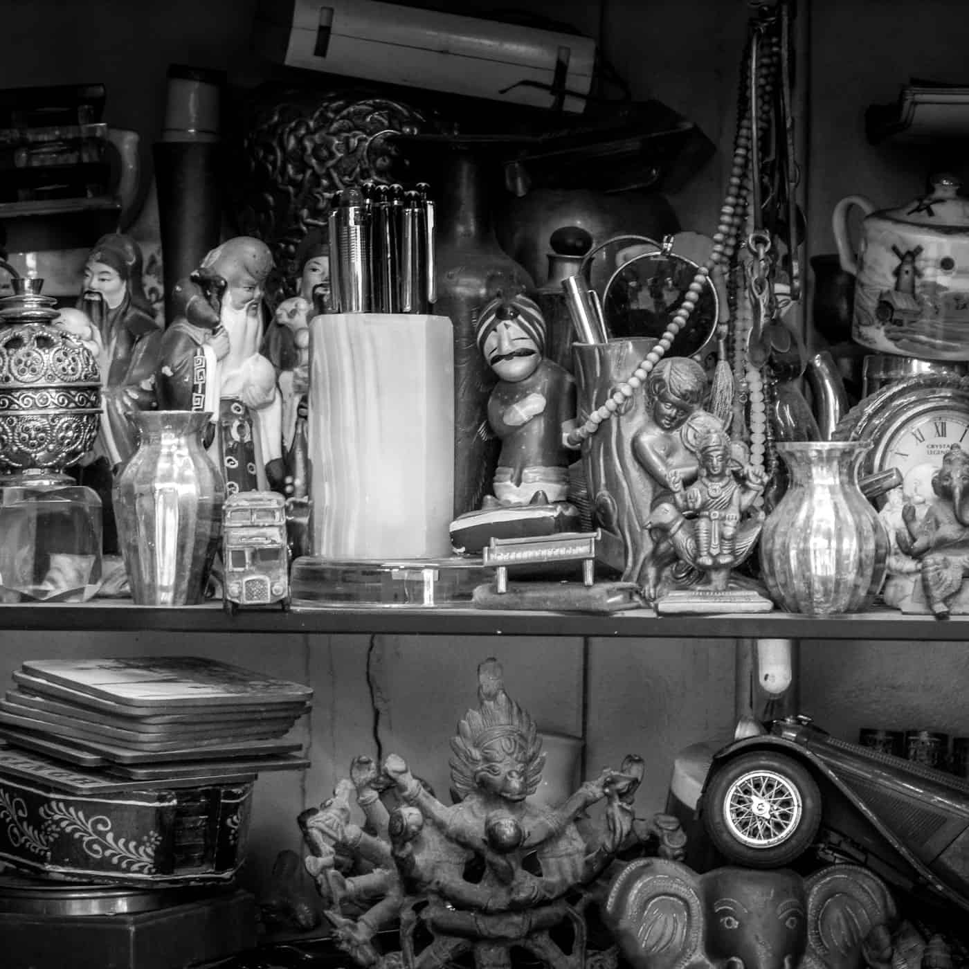 Shelves of assorted vintage trinkets, curios and ornaments