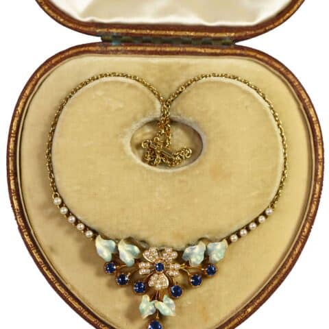 Victorian gold necklace set with sapphires, seed pearls and carved opal leaves, in its original velvet-lined fitted case